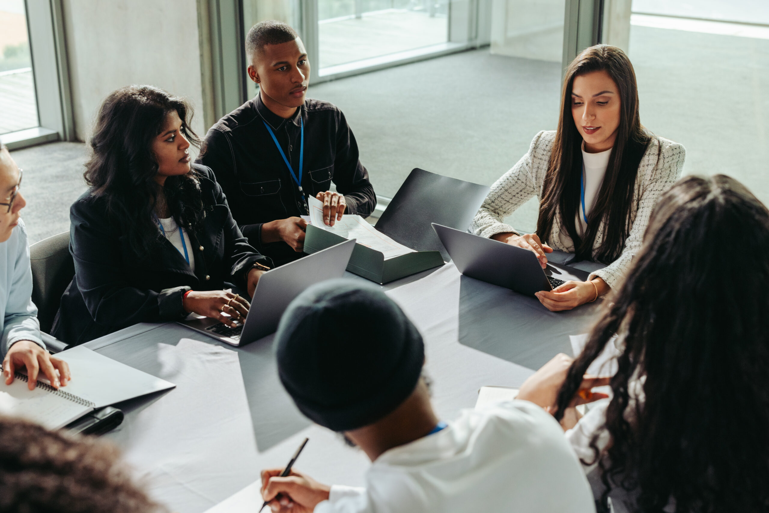 people sitting around table meeting